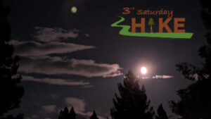 Photo of moon and trees with 3rd Saturday Hike logo.